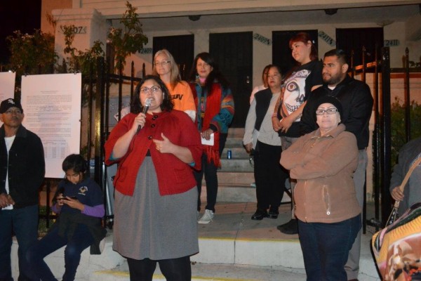 ELACC president Isela Gracián speaks at the celebration, surrounded by several of the tenants. Photos courtesy of ELACC.