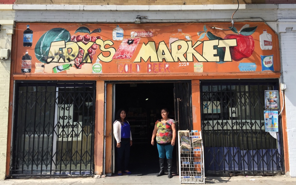Elvira Barrales and Maria Ramirez stand at the building in Boyle Heights they are being evicted from. Community advocates say the area is seeing rapid change as the Sixth Street Bridge is revitalized.