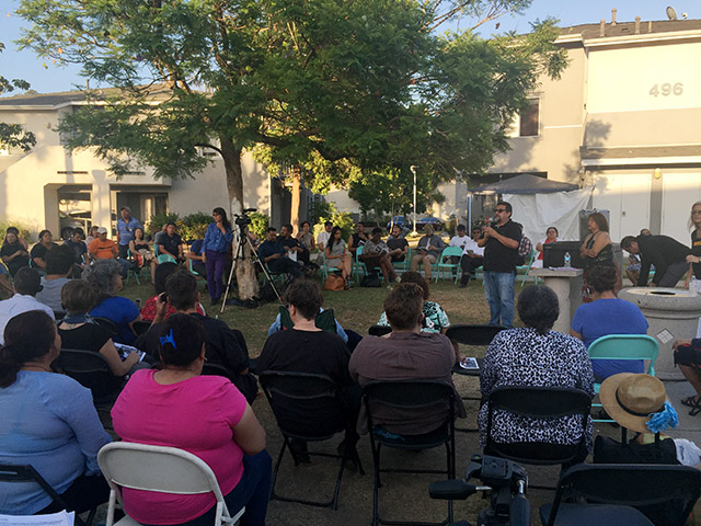 Union de Vecinos cofounder Leonardo Vilchis speaks during the July 13 community meeting at Pico Gardens (Photo by Julia Wick/LAist)