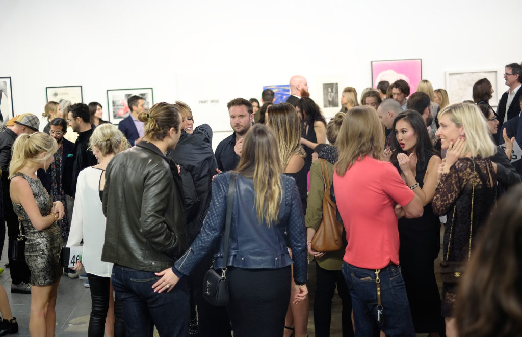Guests at MAMA Gallery in the Arts District west of Boyle Heights. Courtesy of Michael Buckner/Getty Images for Art of Elysium.