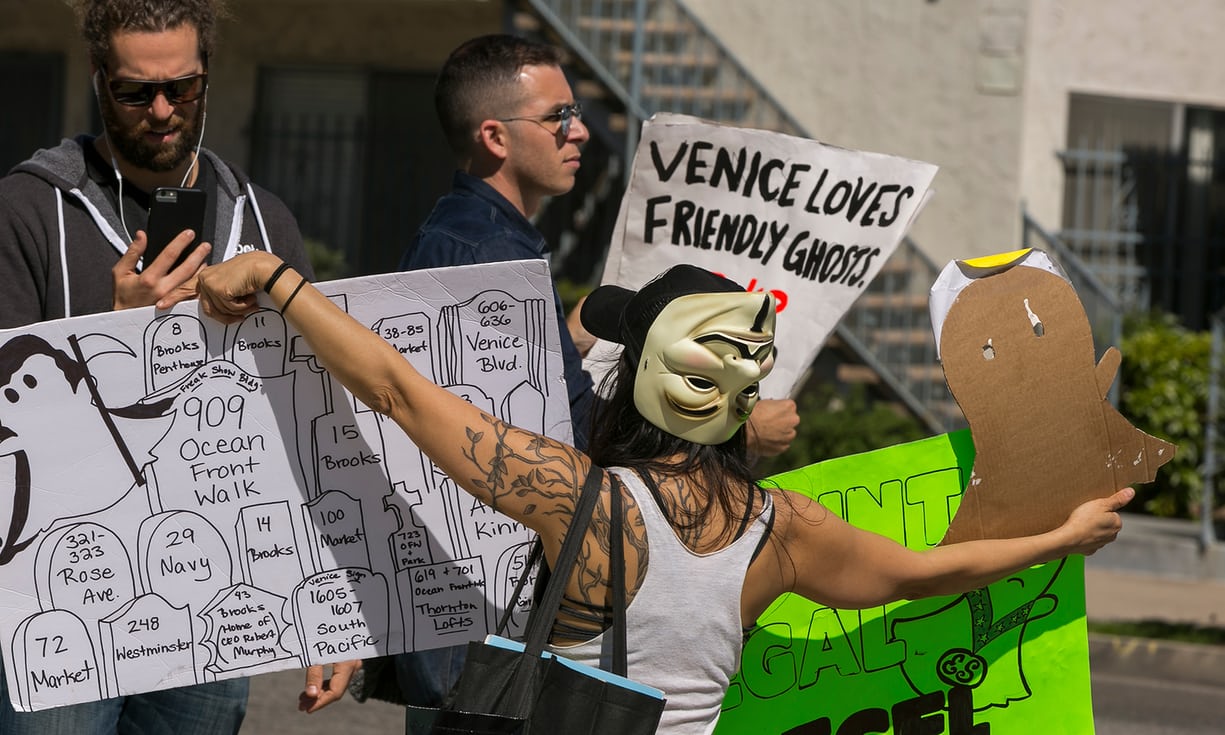Protesters in Venice, California, have picketed the palm-fringed home of Snapchat. Photograph: Damian Dovarganes/AP