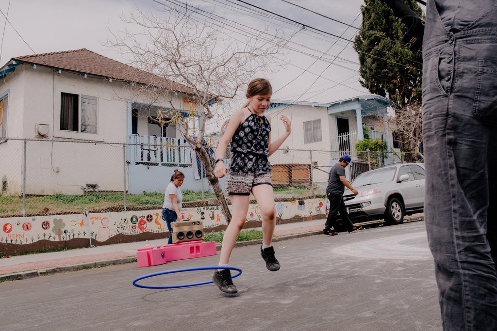 Fickett Street in Boyle Heights, a neighborhood in Los Angeles transformed into a one-day â€œplay streetâ€ as part of a design initiative to reclaim streets for civic life. It was a collaboration with residents, activists, the nonprofit Kounkuey Design Initiative and the Los Angeles Department of Transportation.CreditColey Brown for The New York Times